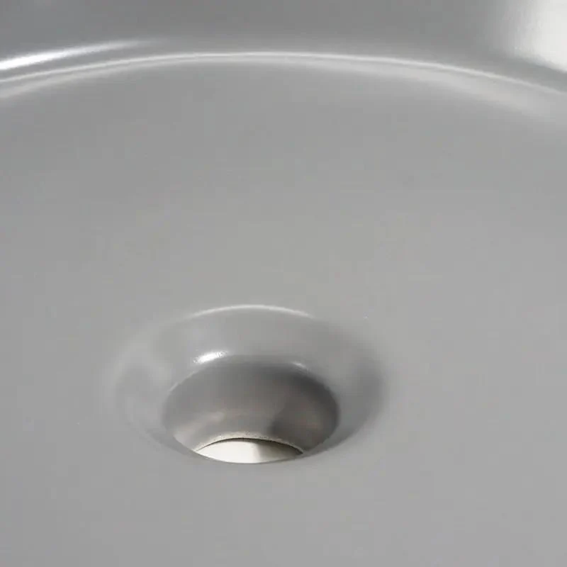 Sleek Round Ceramic Vessel Sink In Matte Gray Finish For A Pretty Sweet Bathroom Glow Up Durable Countertop Basin With Standard Drain Size And Smooth Edge Design
