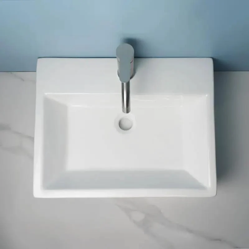 Slick Ceramic Vessel Sink Bathroom Washbasin Above Ground Wall Mount Basin With Sharp Modern Luxury Lines Smooth Glaze Finish Effortless Install Top Shelf Durable Contemporary Fixtures