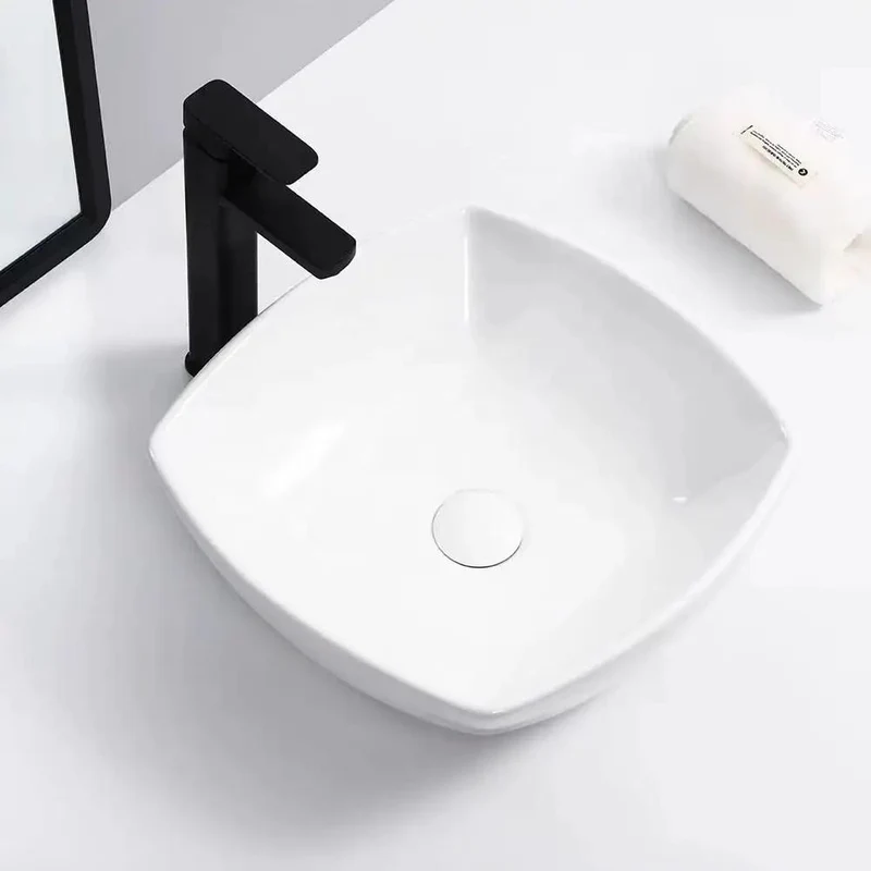 Sleek Square Ceramic Vessel Sink for Your Oasis. Modern Countertop Wash Basin with High Gloss Finish. Easy Wipe Clean Design That Slays and Never Yellows. Hotel Grade Quality for a Bougie Vibe. Durable Stain Resistant Sink.