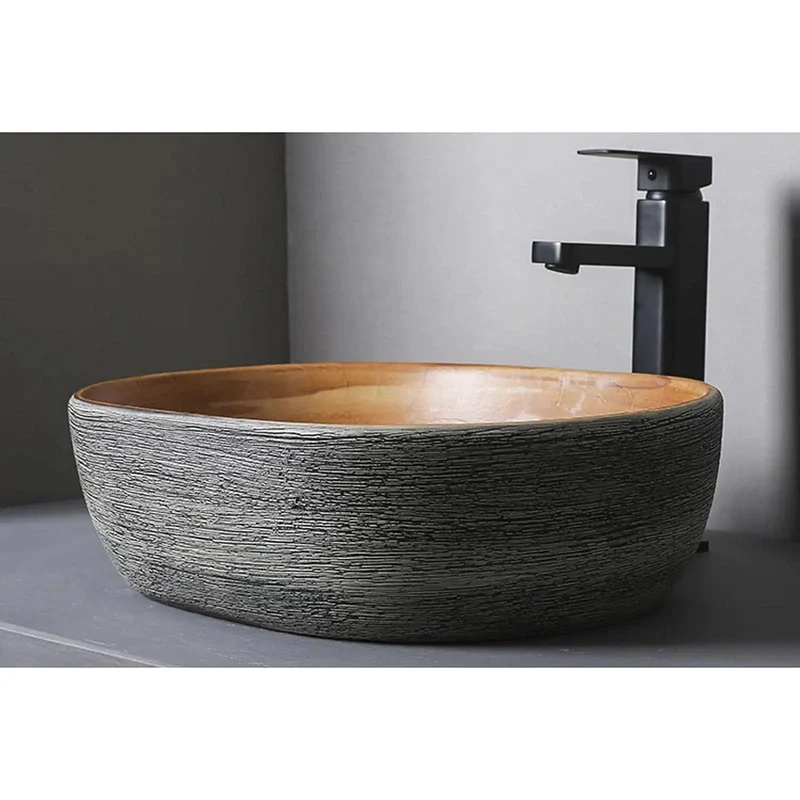 Smooth Glazed Ceramic Countertop Bathroom Sink With Graceful Oval Vessel Shape, Hand Carved Curves That Bring Next Level Vanity Vibes, Heavy Duty Construction Built To Handle Daily Use Without Skipping A Beat, Includes Matched Copper Hardware And