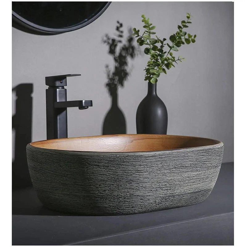 Smooth Glazed Ceramic Countertop Bathroom Sink With Graceful Oval Vessel Shape, Hand Carved Curves That Bring Next Level Vanity Vibes, Heavy Duty Construction Built To Handle Daily Use Without Skipping A Beat, Includes Matched Copper Hardware And