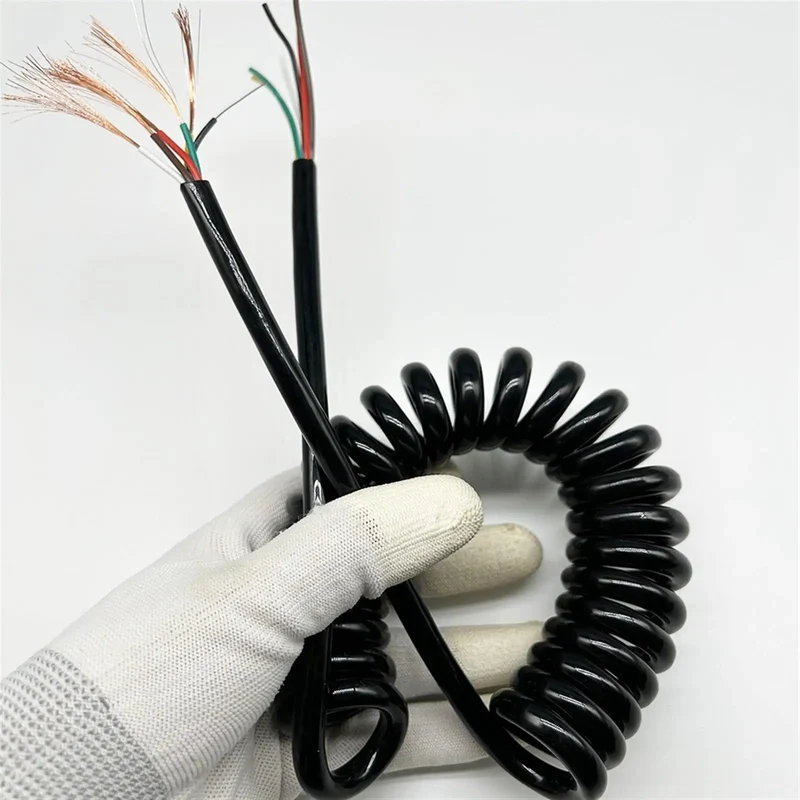 Slick Black Braided Expandable Power Cord With Coiled Spring Design Offers Snappy Auto Retracting Action That Gives You Extra Reach Without The Mess Perfect For Workspaces And Living Spaces