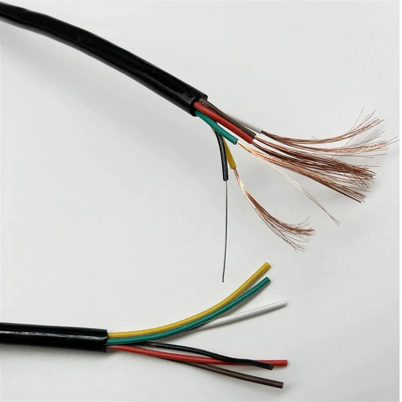 Slick Black Braided Expandable Power Cord With Coiled Spring Design Offers Snappy Auto Retracting Action That Gives You Extra Reach Without The Mess Perfect For Workspaces And Living Spaces